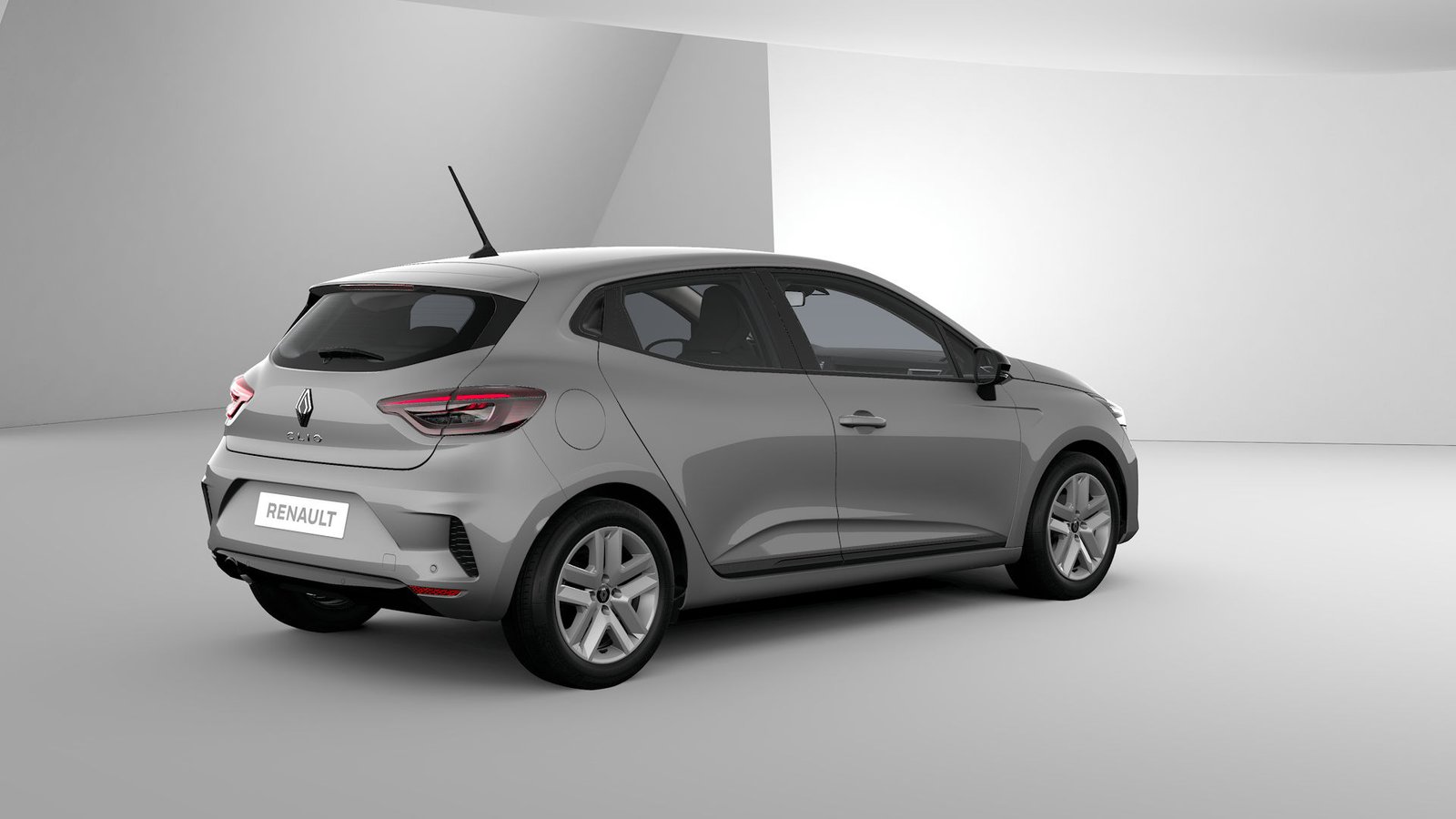 Gray Renault Clio rental hatchback, rear three-quarter studio view