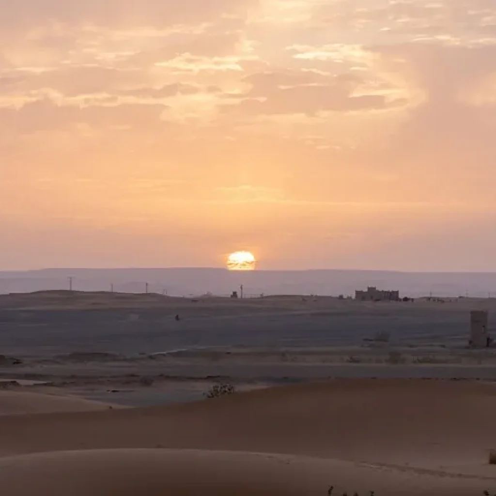 Sunrise over the town of Merzouga and the Erg Chebbi sand dunes, Morocco